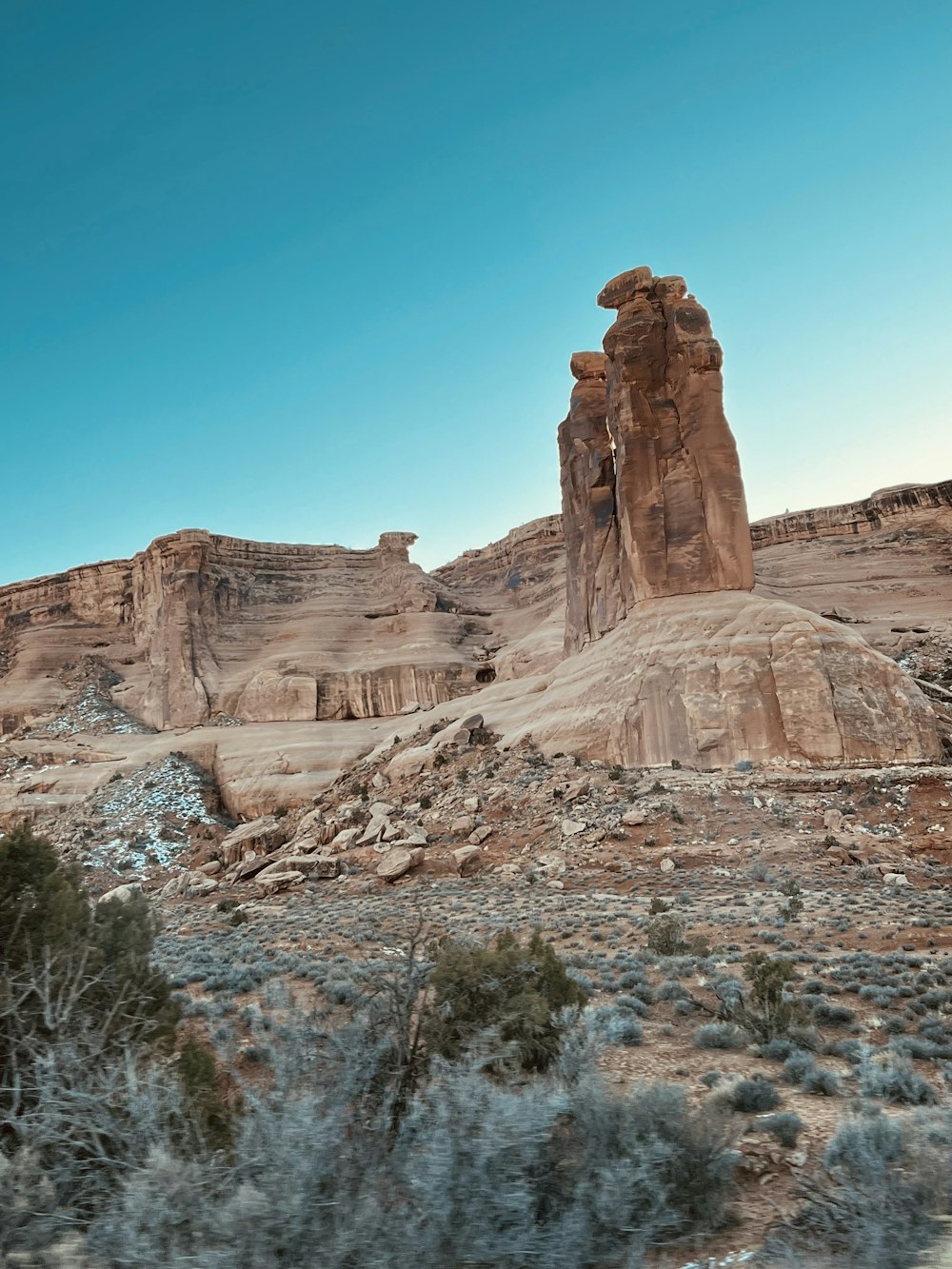 a rocky mountain with trees