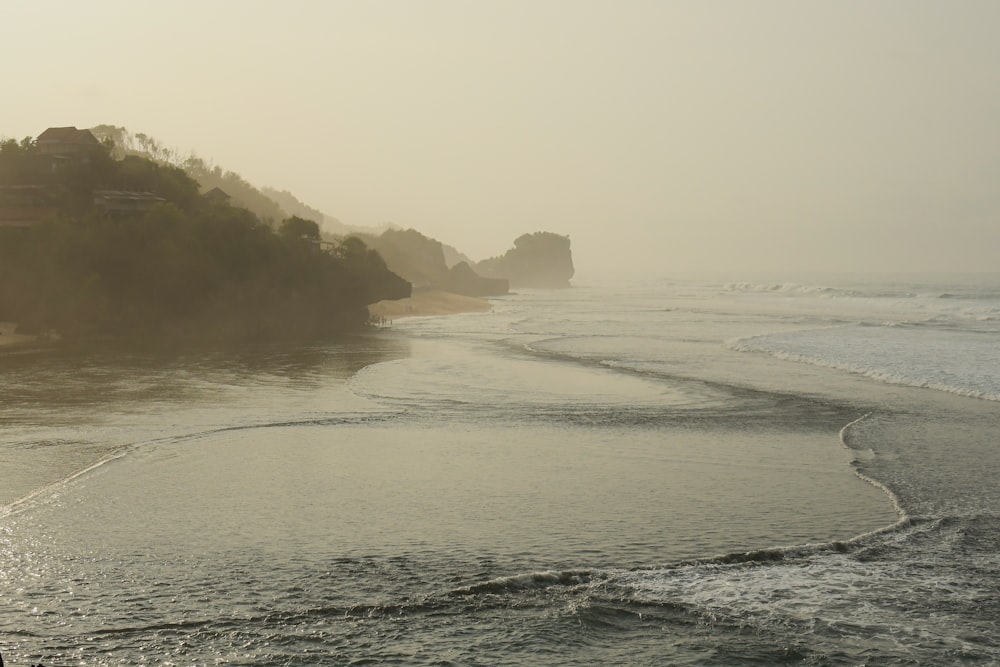 a beach with a few large rocks