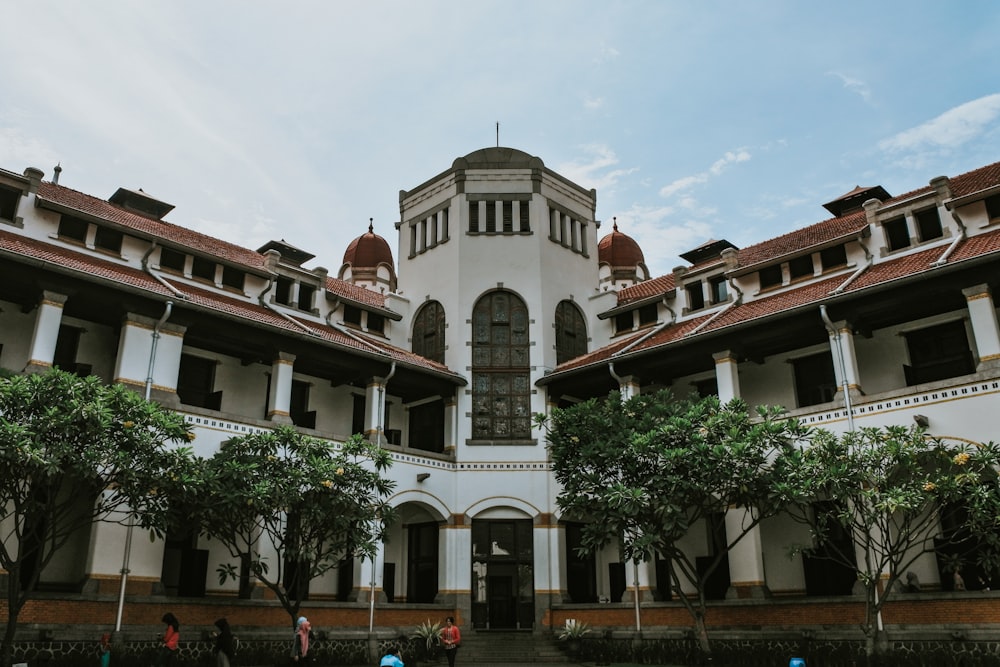 a large building with trees in front of it