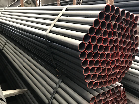 Photo of Hariom Traders warehouse stacked with Prince DWC pipes ready for delivery in Delhi NCR.