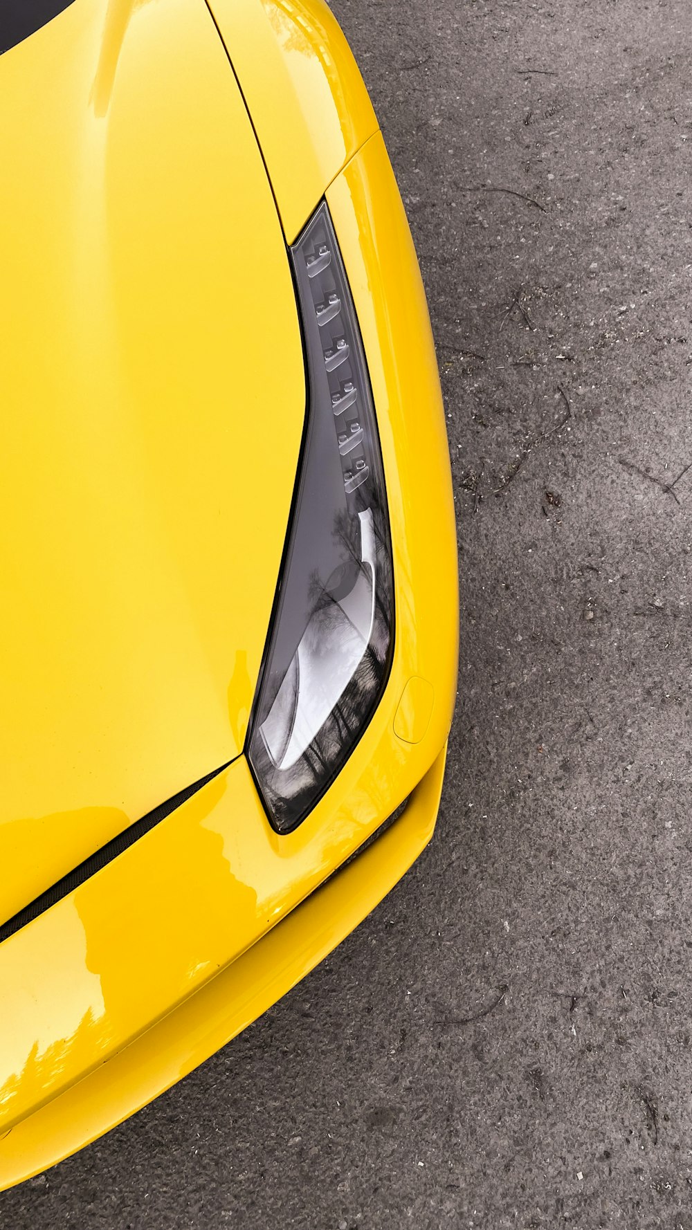 a yellow car with a black rim