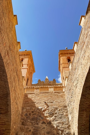 a stone building with a blue sky
