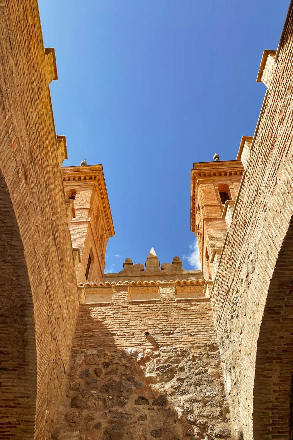 a stone building with a blue sky