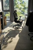 Ergonomic mesh chair in a modern home office, bathed in natural light from a nearby window.