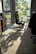 Professional cleaner using eco-friendly equipment on an office chair upholstery.
