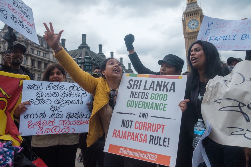 a group of people holding signs