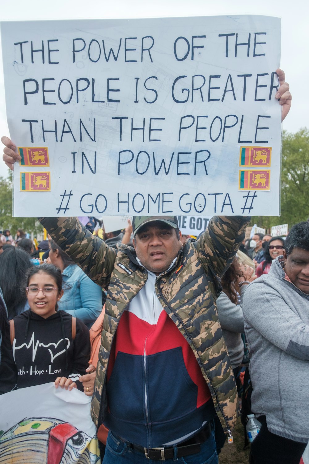 a man holding a sign