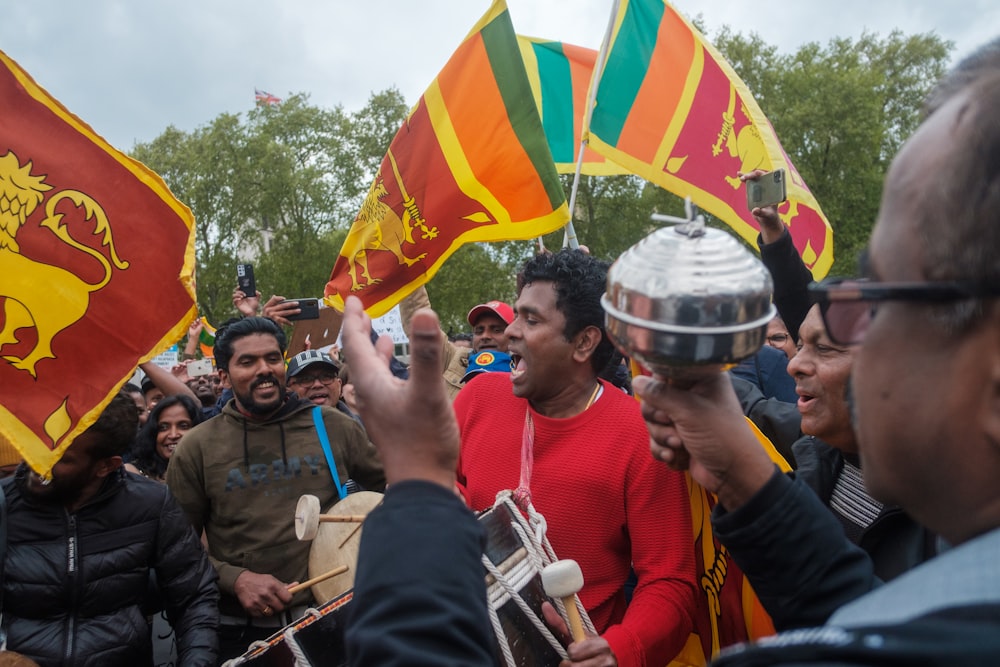 a group of people holding flags