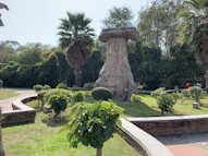 a statue in a garden