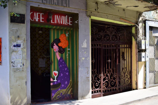 A vibrant mural covering a cafe wall, blending bold colors and intricate details that invite patrons in.