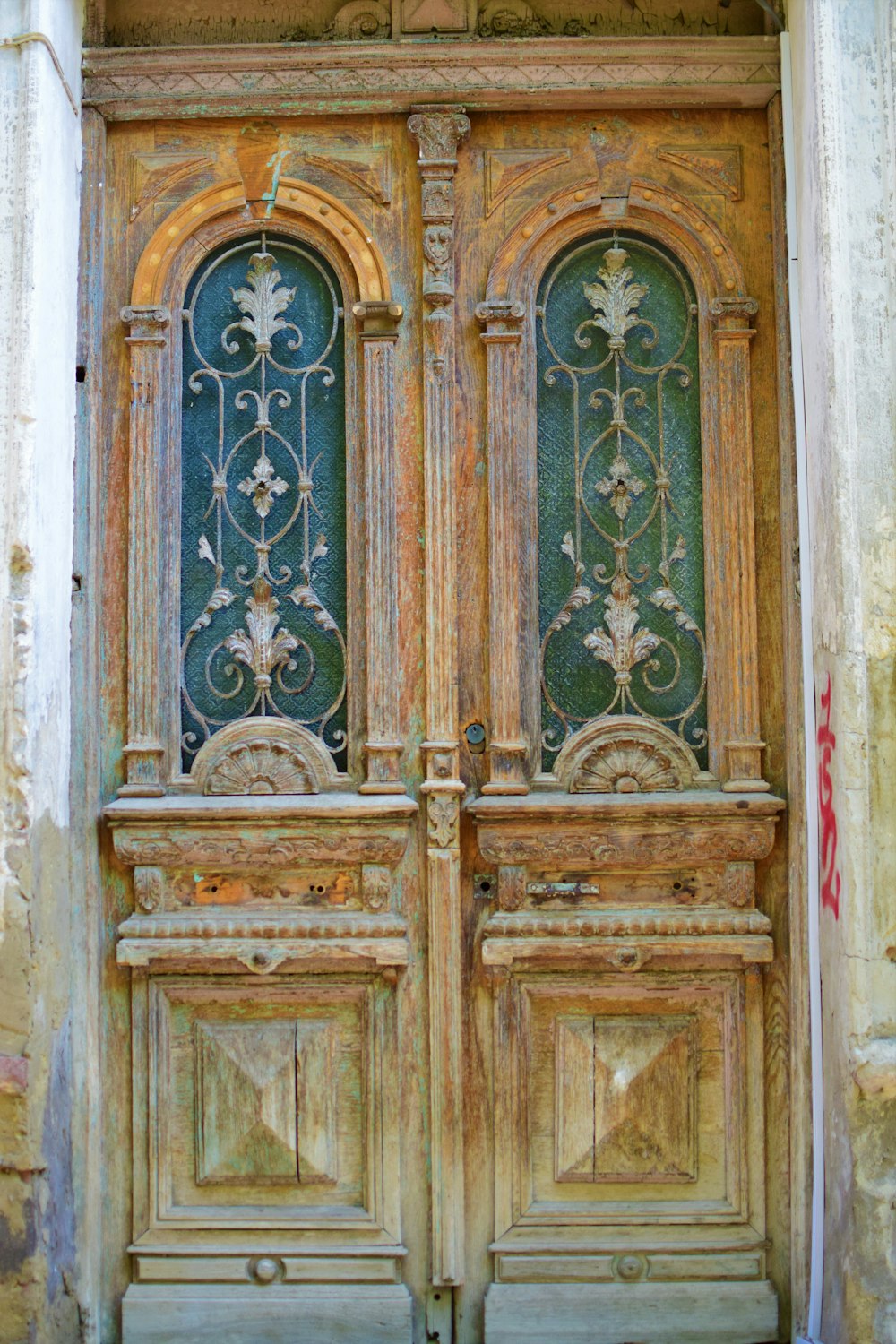 a wood door with a design on it