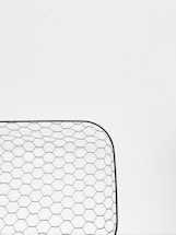 A friendly customer service representative ready to assist with mesh product inquiries.