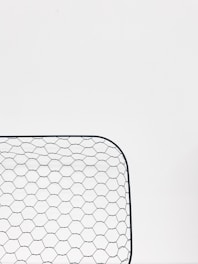 A display of various wire mesh products available for sale.