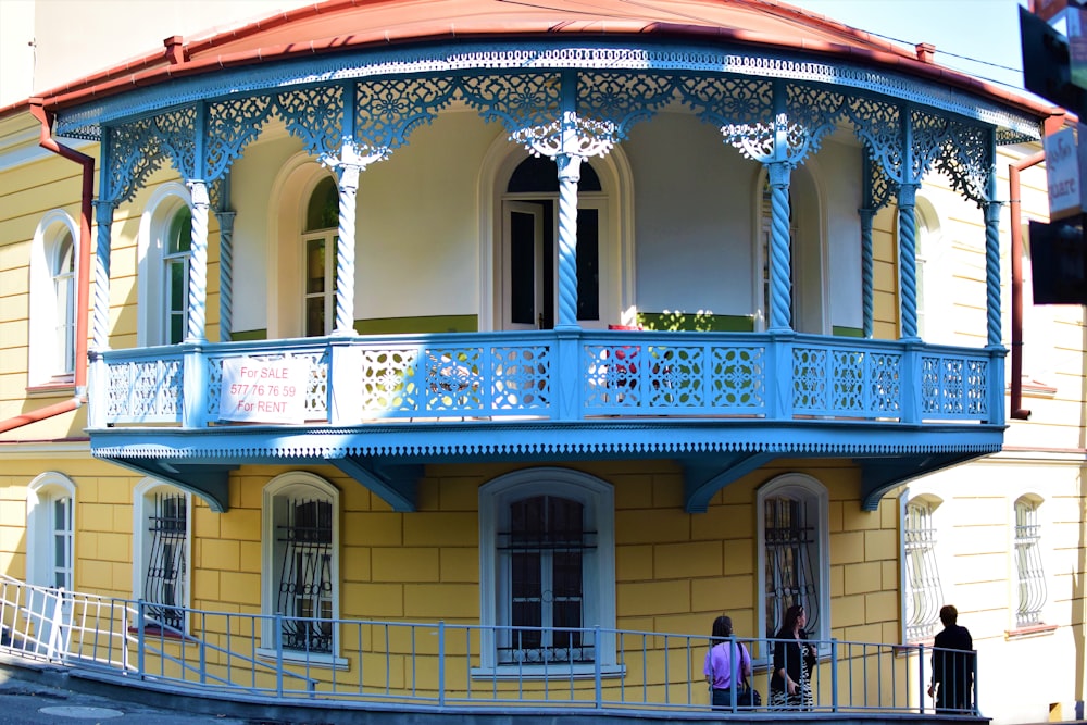 a building with a blue railing