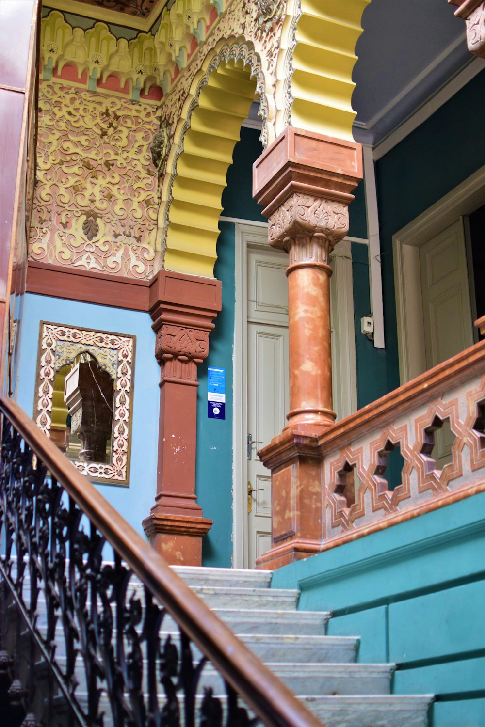 a staircase leading up to a colorful building