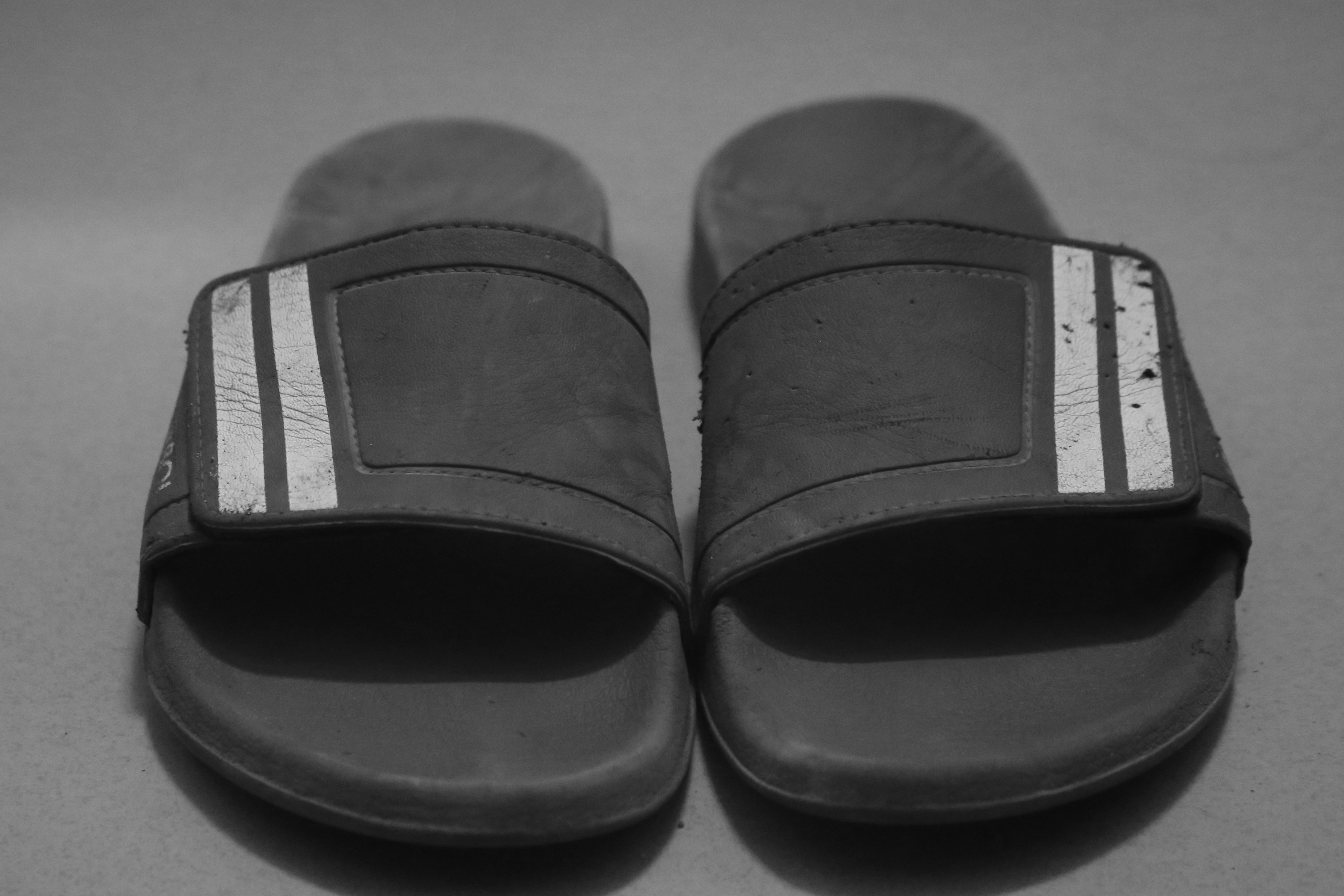 a pair of black slippers