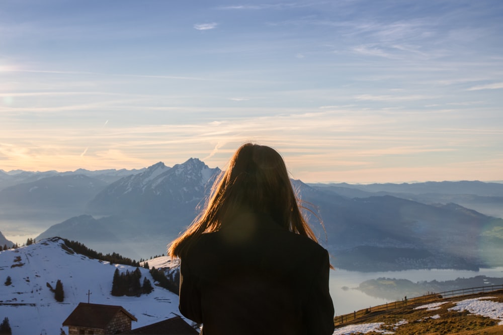 a person standing on a snowy hill