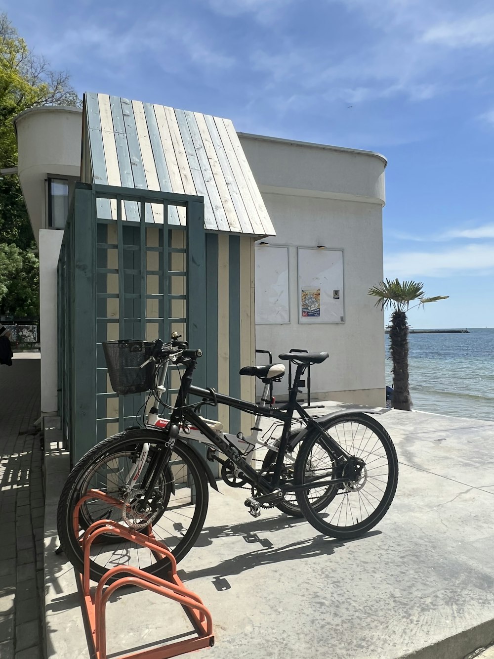 a bicycle parked on a sidewalk