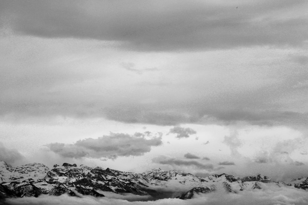 a mountain range with clouds