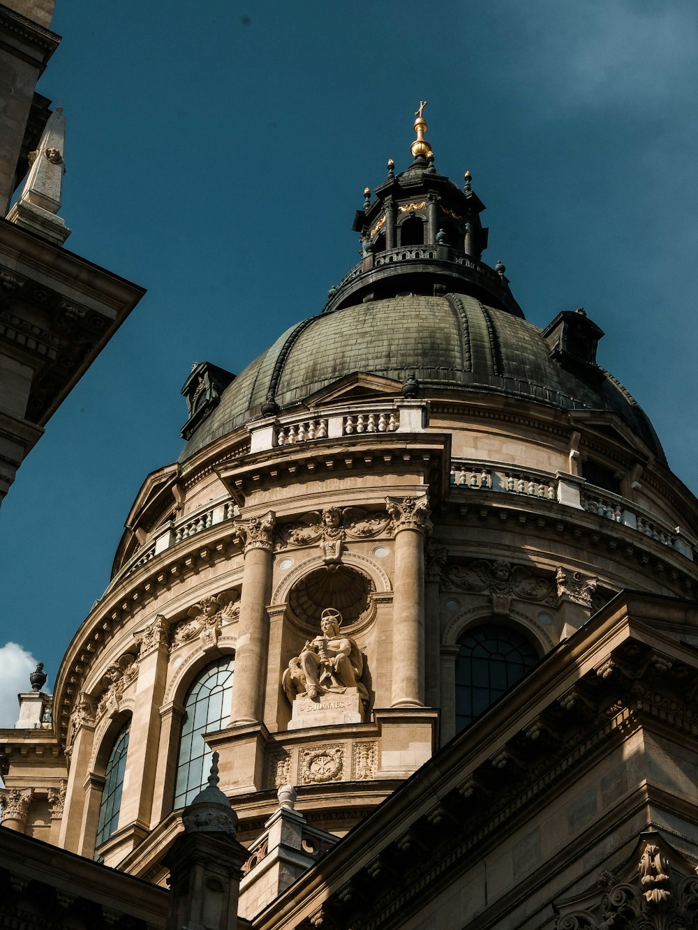 a building with a dome and statues