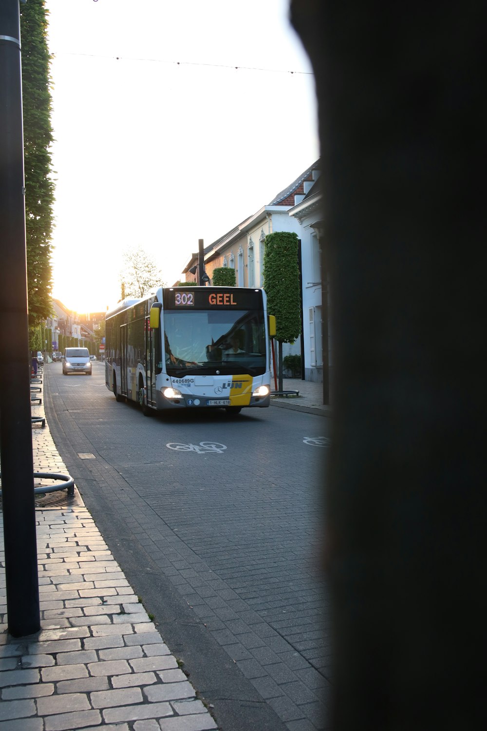a bus travels down a street