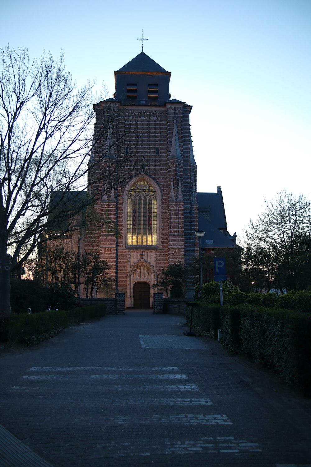 a brick building with a cross on top