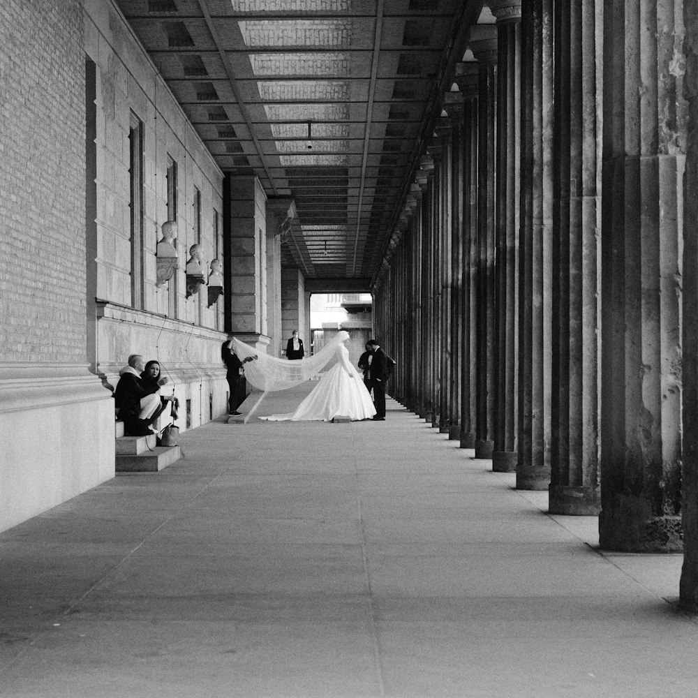 a bride and groom walking down the aisle