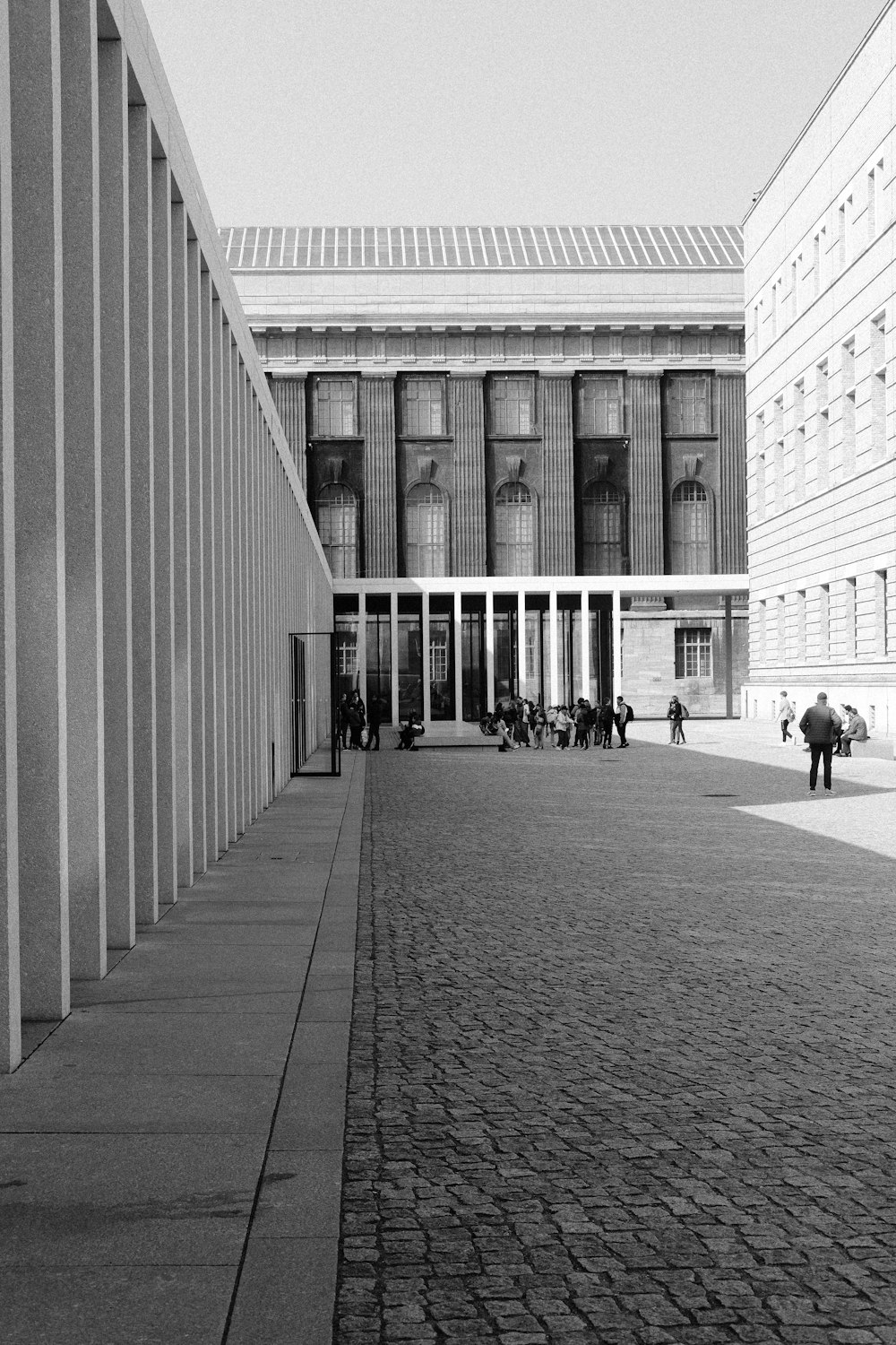 a stone walkway between buildings