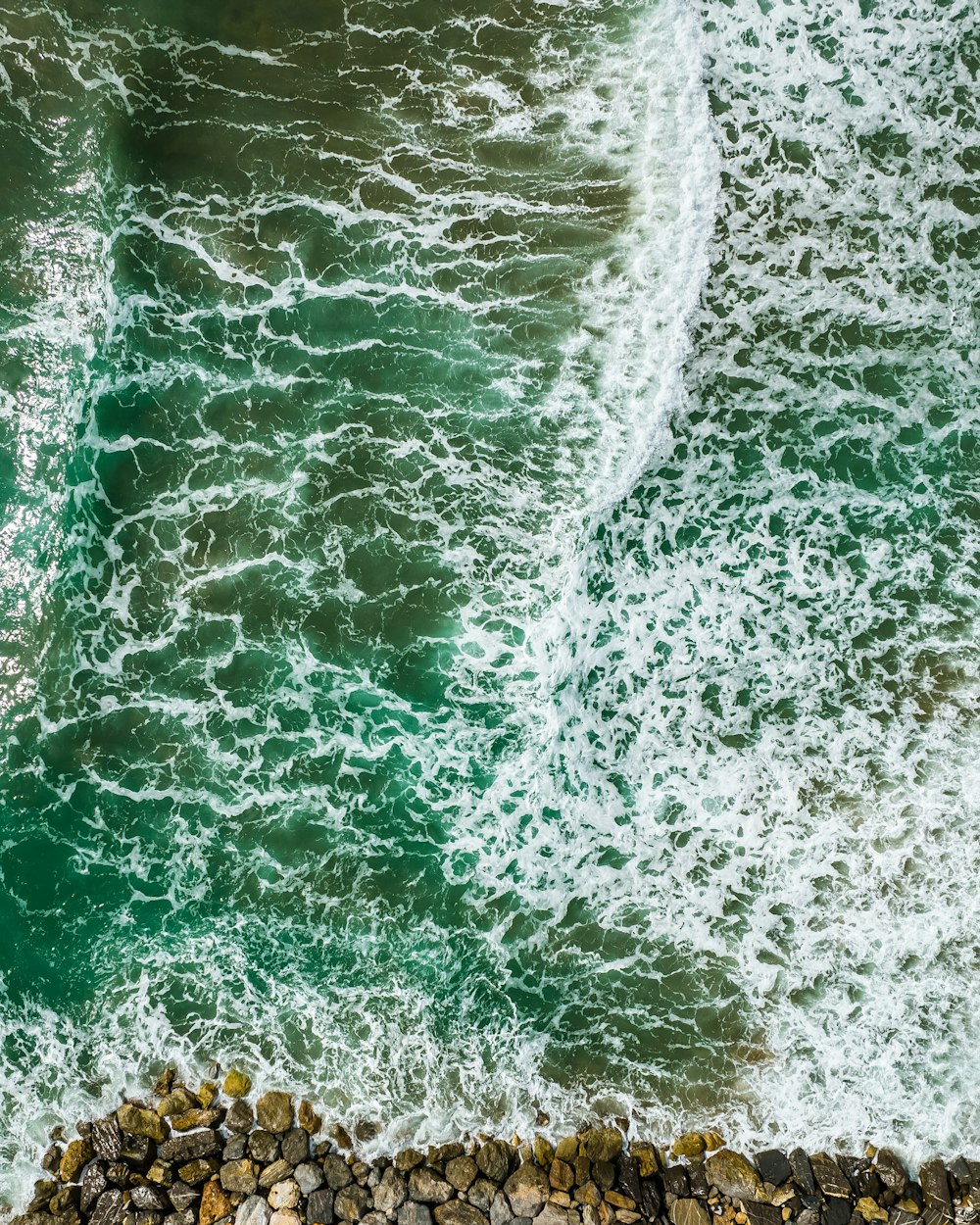 a wave crashing on a rock