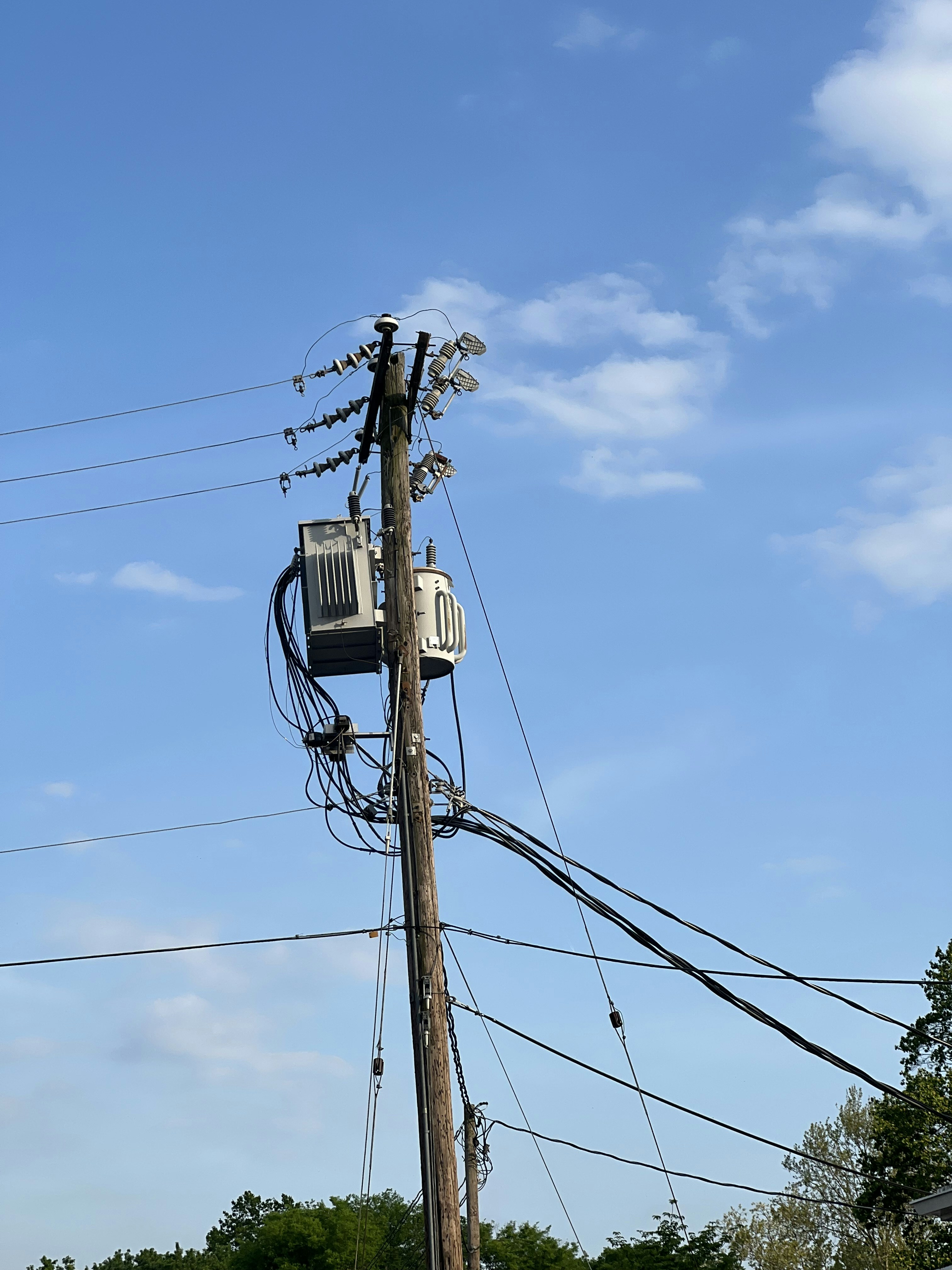 a telephone pole with power lines