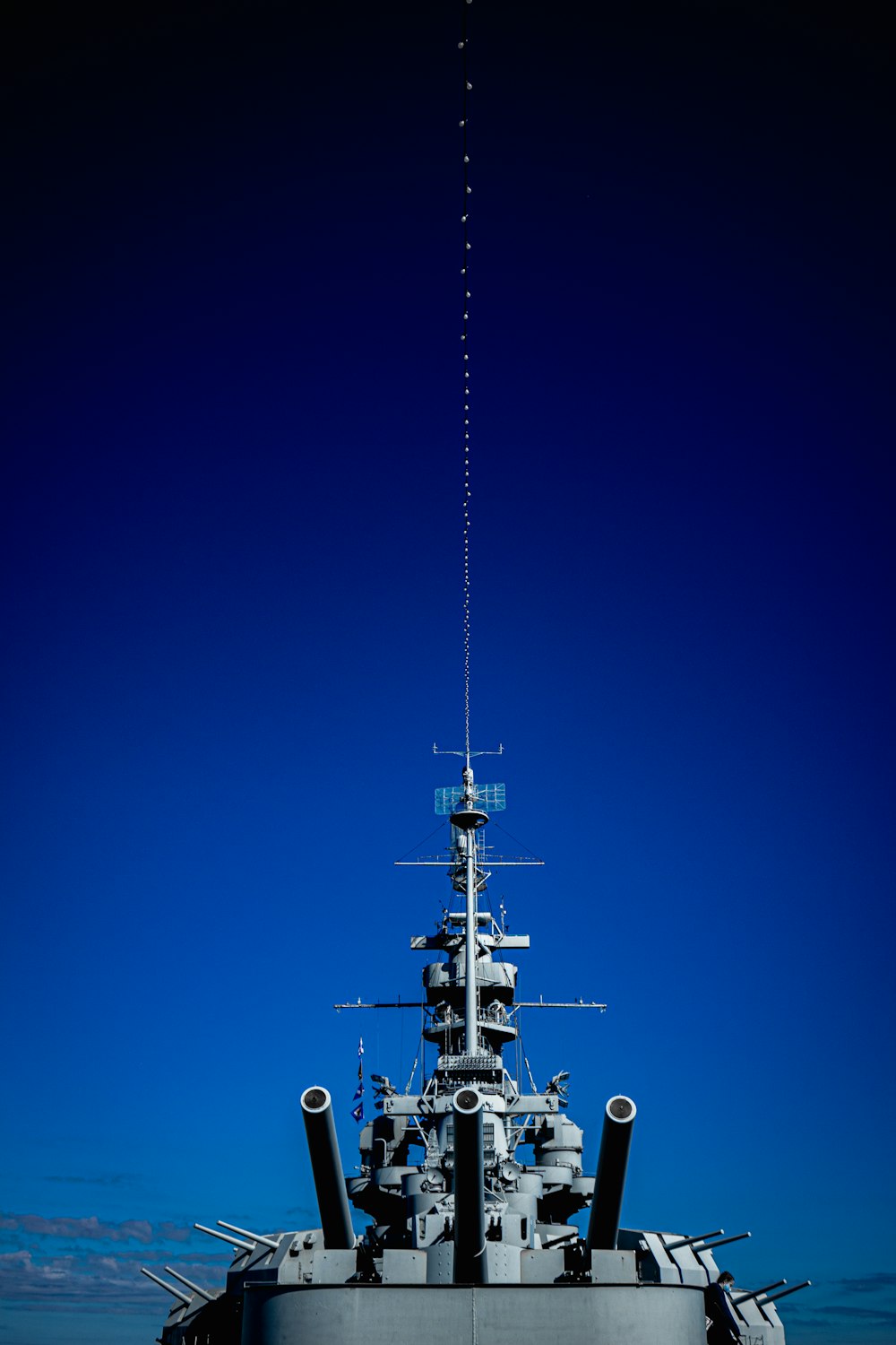 a large ship with a blue sky