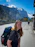 Smiling young woman enjoying a scenic mountain view during her tour