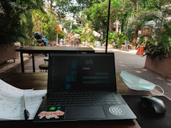 a laptop sits on a table