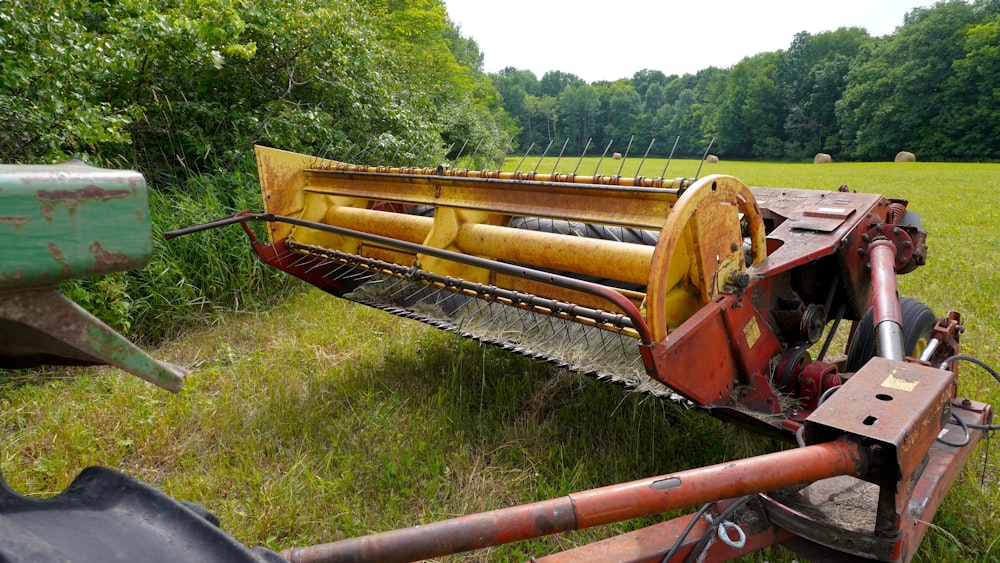a large rusted out machine in a field