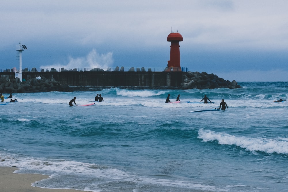 a group of surfers in the ocean