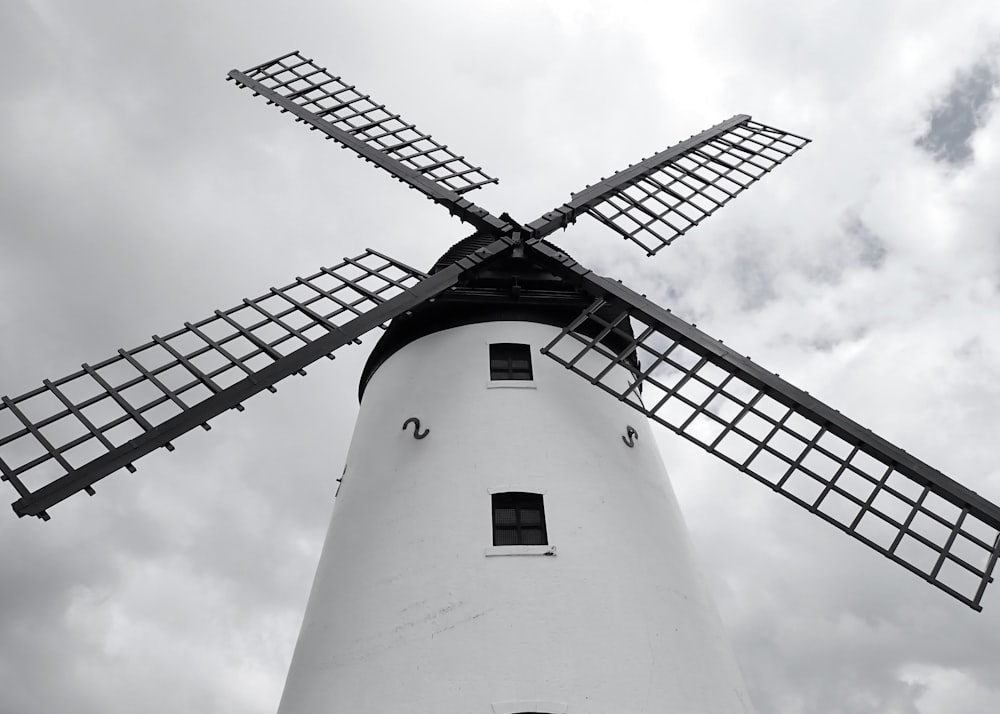 a windmill with a cloudy sky