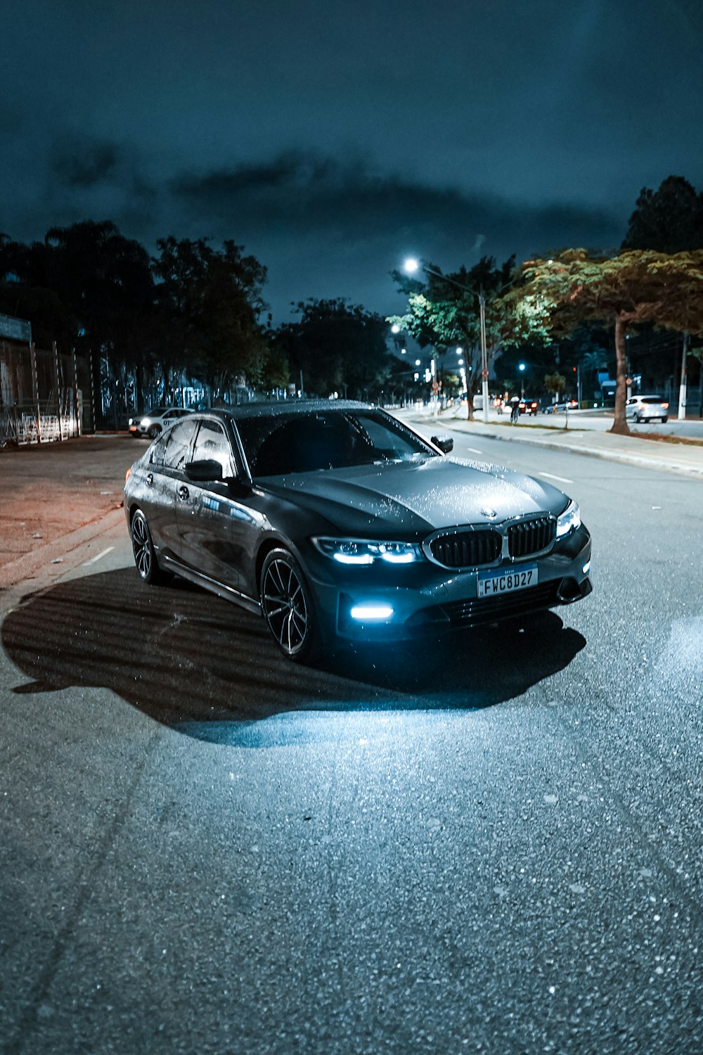 a car parked on a street at night