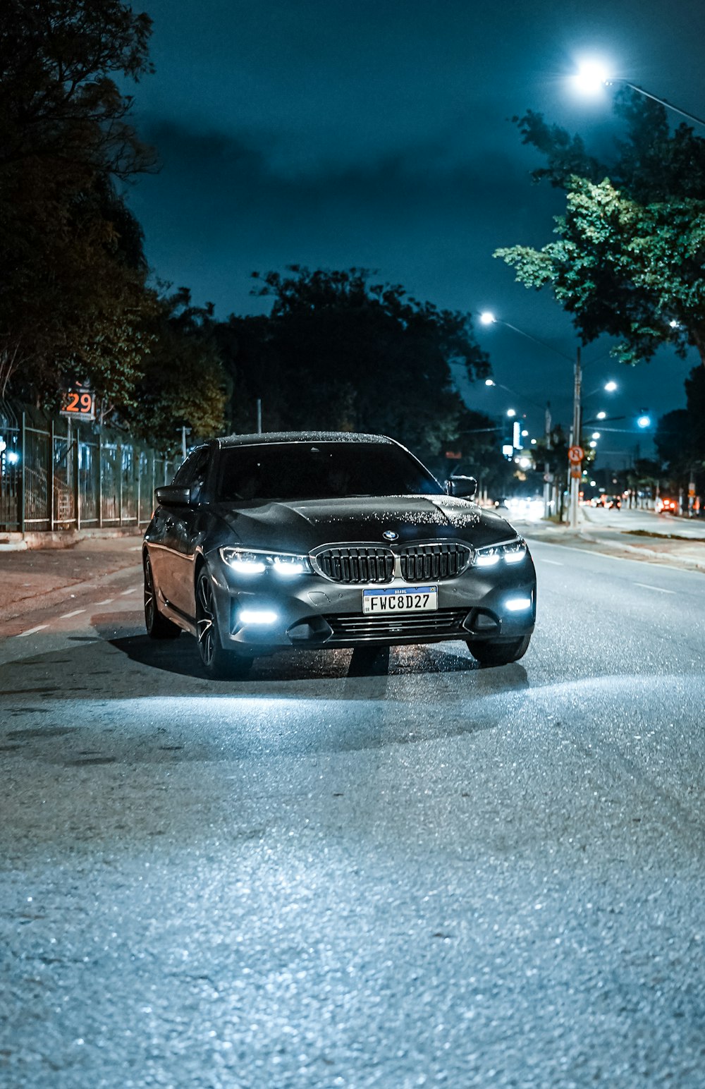 a car parked on a street at night