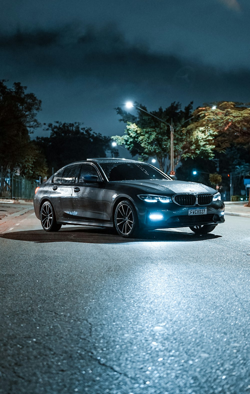 a car parked on a street at night