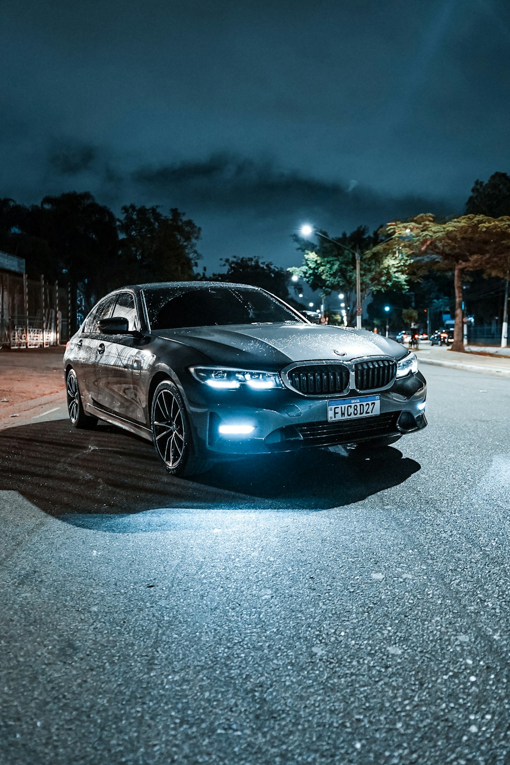 a car parked on a street at night