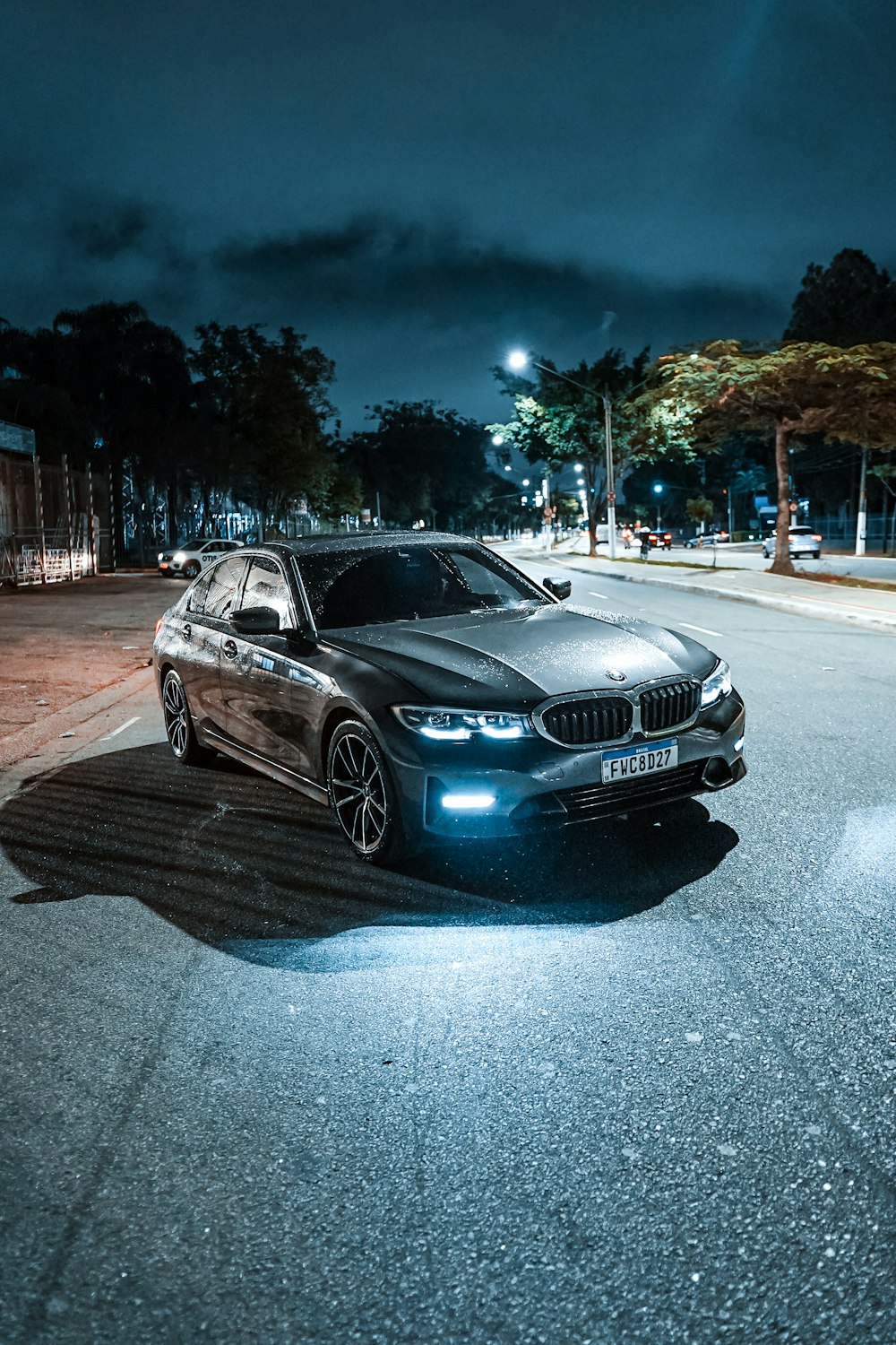 a car parked on a street at night