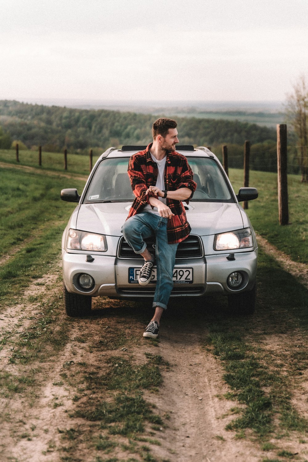 a man standing on a car