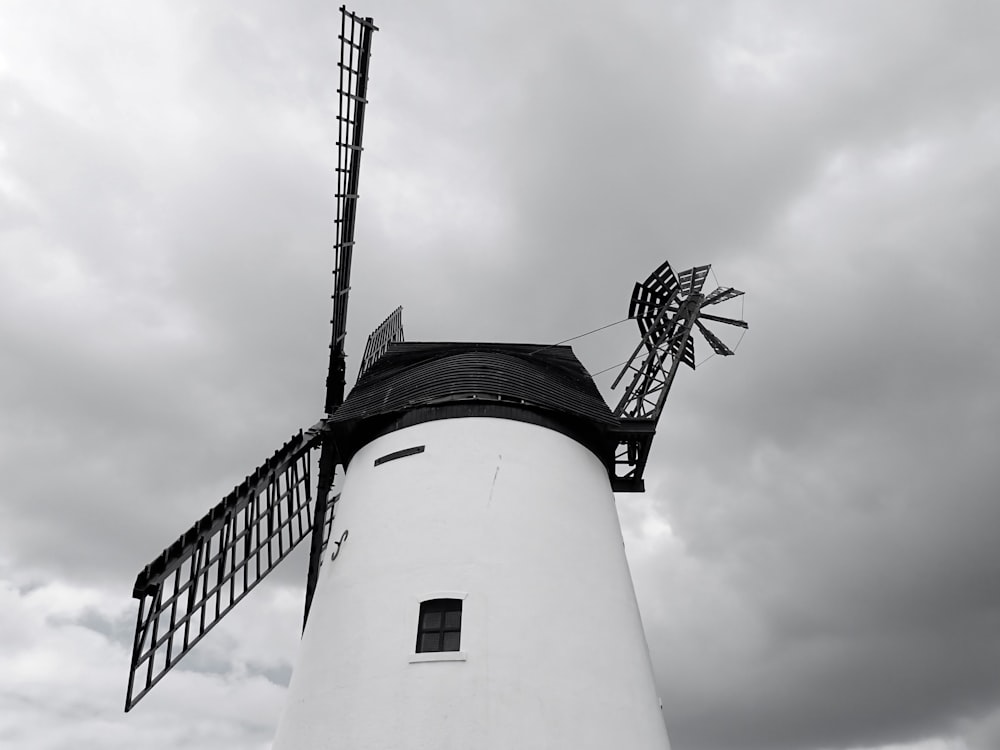 a windmill with a cloudy sky