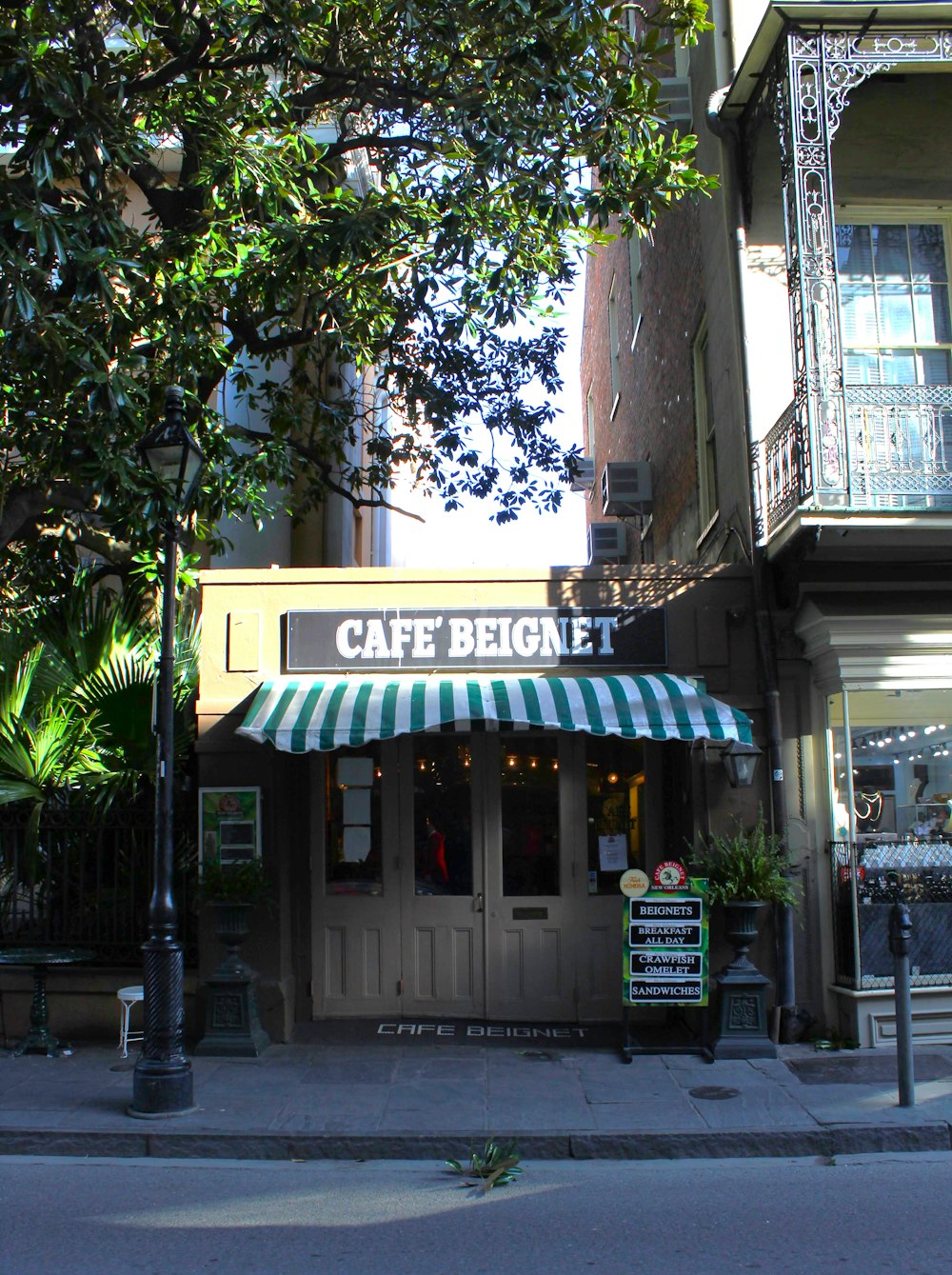 a store front with a green awning