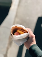 A busy Houston gas station customer enjoying a habibi deli wrap on the go.