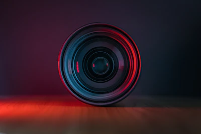 Close-up of a camera lens capturing a dramatic moment during filming.