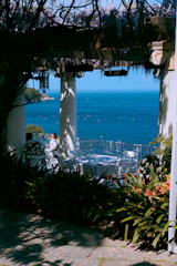 A peaceful terrace overlooking the sea with minimalist, elegant furniture.