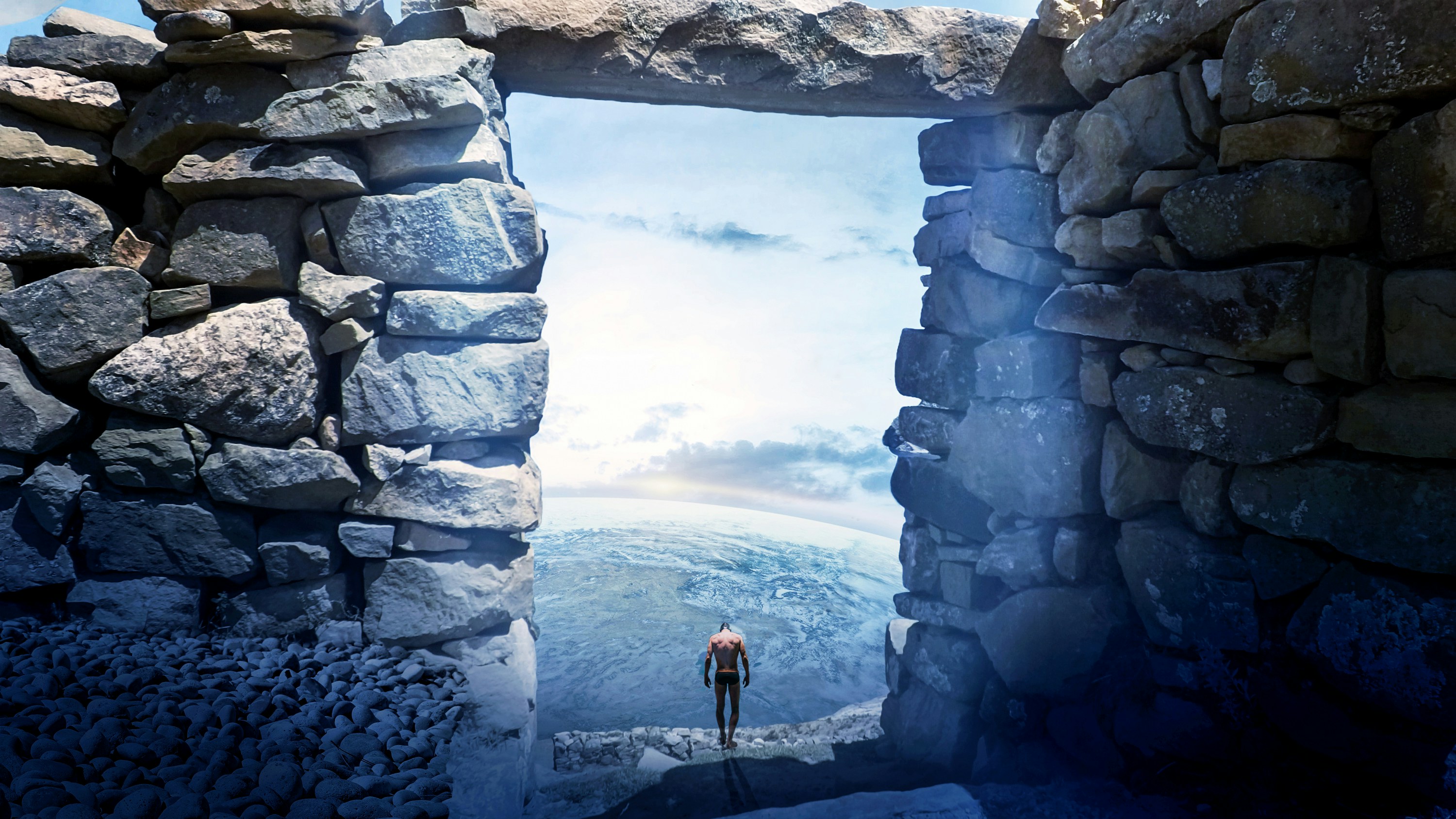 a person standing on a cliff