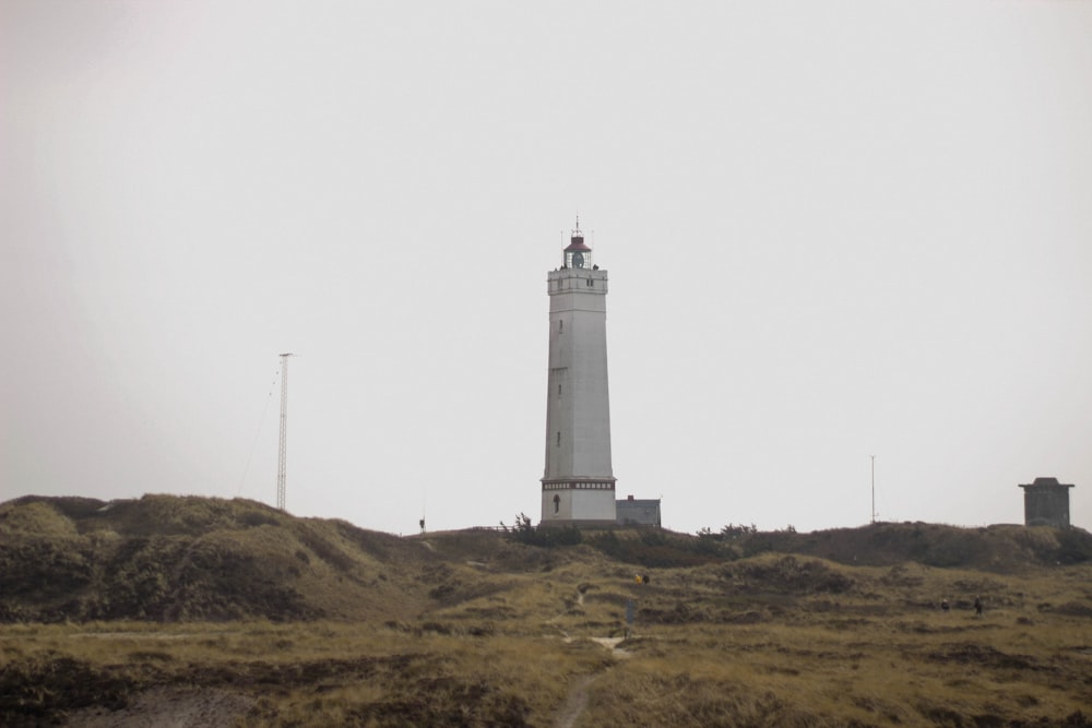 a lighthouse on a hill