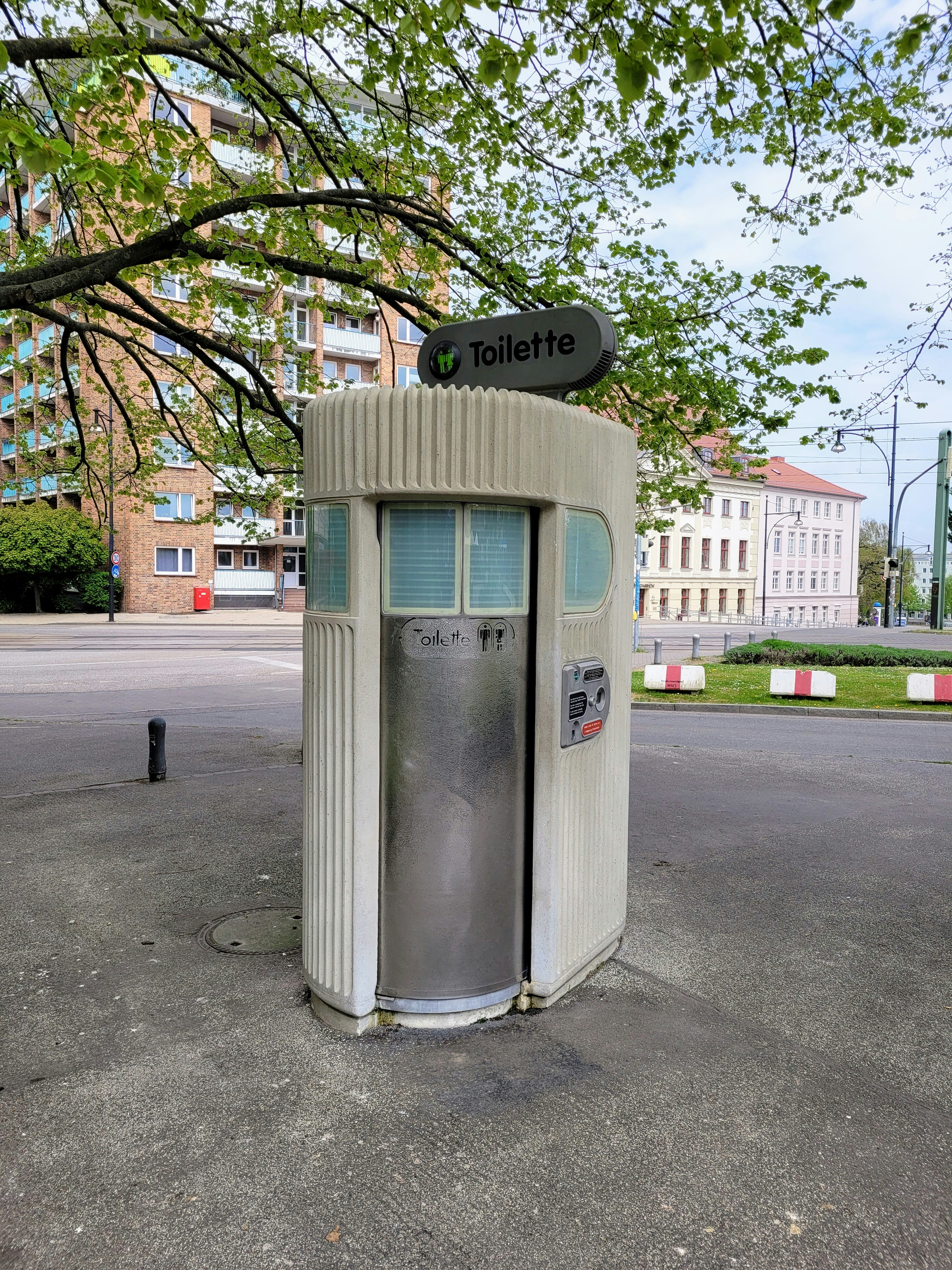 a parking meter on the side of the road